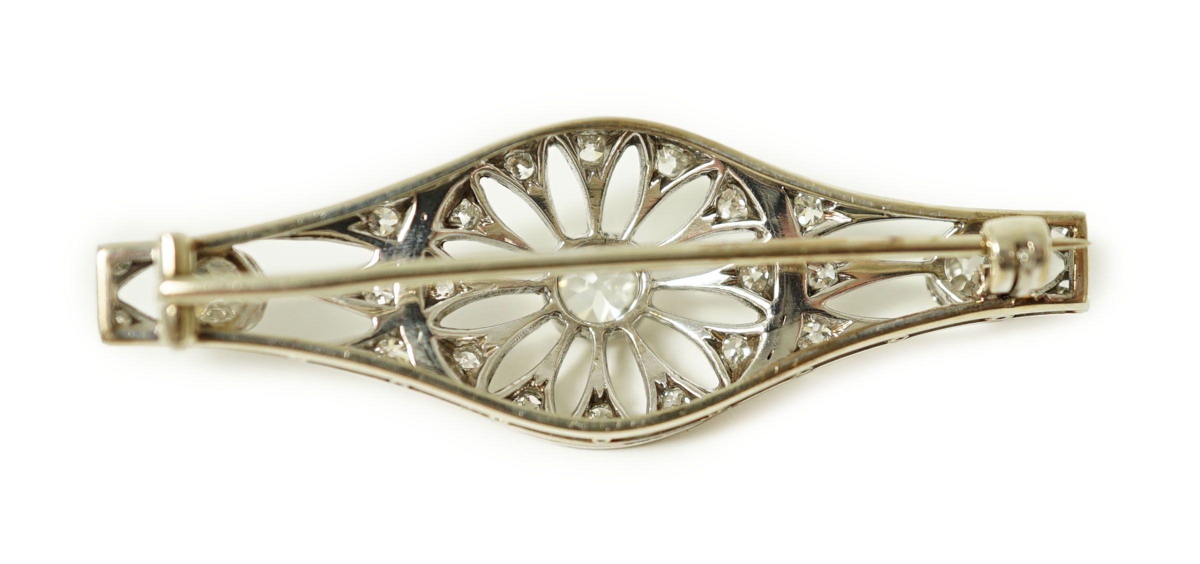 A 1920's pierced white gold and diamond cluster set brooch